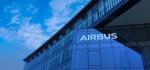 The white Airbus logo on a glass facade