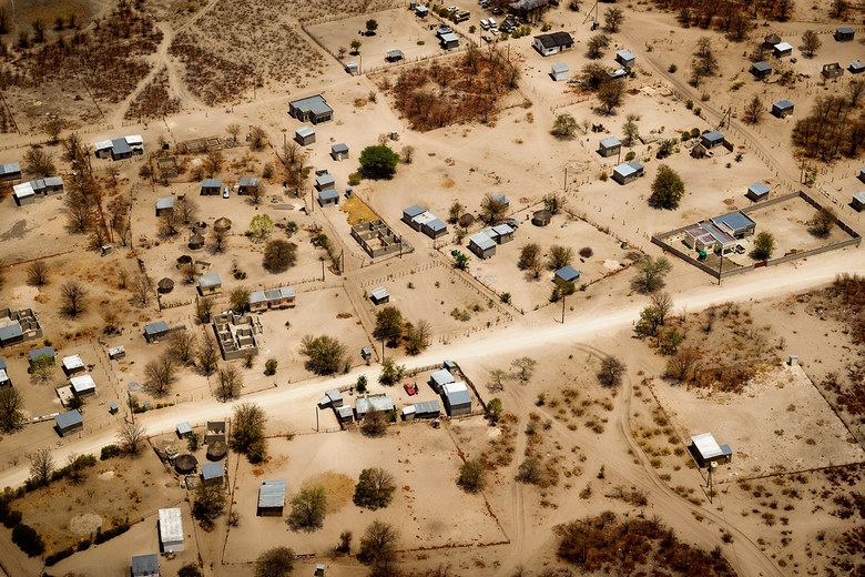 Aerial view of a village on dry land.